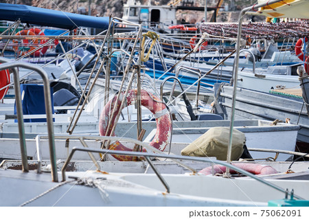 background - details of the structures of the boats standing in the harbor merge with each other background - details of the structures of the boats standing in the harbor merge with each other 75062091