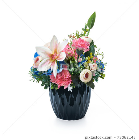Flower arrangement in a blue vase on white background. 75062145