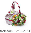 Festive basket with a flower arrangement on white background 75062151