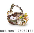Easter basket from a flower arrangement on white background 75062154