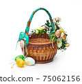 Easter basket from a flower arrangement on white background 75062156