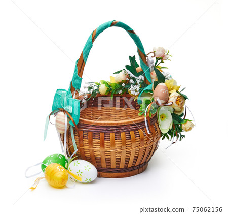 Easter basket from a flower arrangement on white background Easter basket from a flower arrangement on white background 75062156