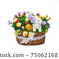 Easter basket from a flower arrangement and a hare on white background 75062168