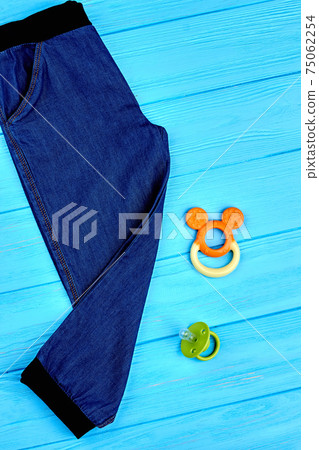 Kids jeans and accessories, top view. Kids jeans and accessories, top view. 75062254