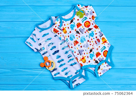 Fancy baby bodysuits, top view. Fancy baby bodysuits, top view. 75062364