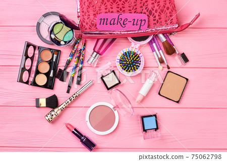 Fashion makeup essentials, wooden background. 75062798