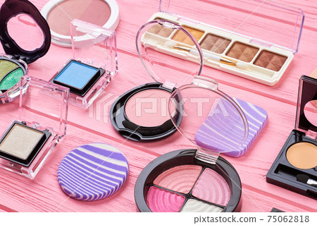 Set of colorful eyeshadows, wooden background. Set of colorful eyeshadows, wooden background. 75062818