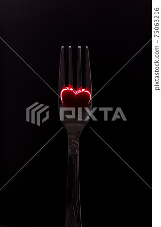 Silver fork and red heart. 75063216