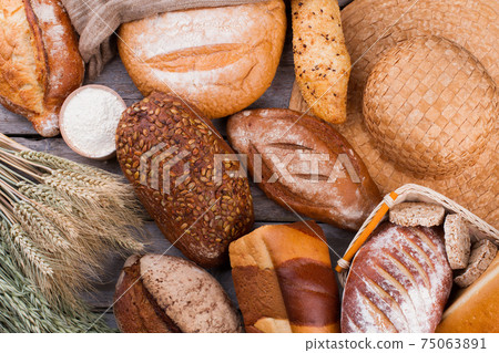 Assorted whole grain bread background. Assorted whole grain bread background. 75063891