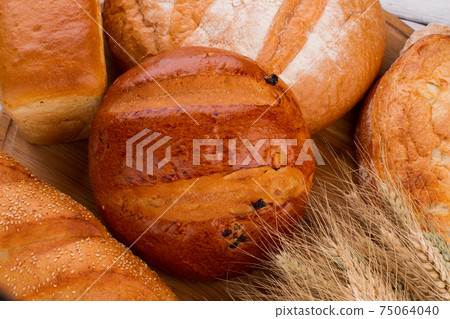 Various bakery products and wheat ears. Various bakery products and wheat ears. 75064040