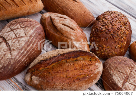 Fresh bread loaves background. 75064067