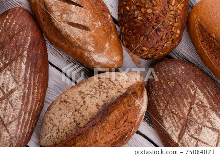 Homemade crusty artisan bread loaves. Homemade crusty artisan bread loaves. 75064071