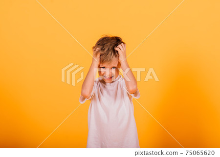 Funny kid, handsome little boy, surprised nine years old child 75065620