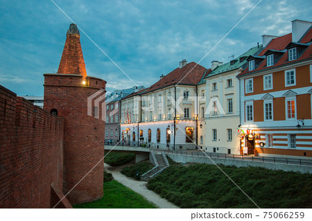 Royal Castle and beautiful street in Old Town during evening blue hour 75066259