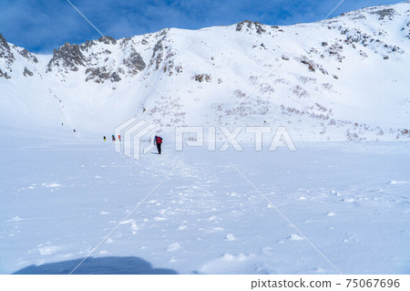 Climbers climbing Senjojiki Cirque in winter [Nagano Prefecture] 75067696
