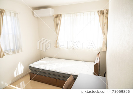 Bedroom with bright single bed Bedroom with bright single bed 75069896