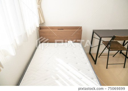 Bedroom with bright single bed Bedroom with bright single bed 75069899