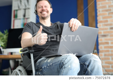 Disabled man works remotely in call center Disabled man works remotely in call center 75072878