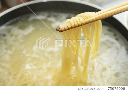 Scene of raising boiled pasta with chopsticks Scene of raising boiled pasta with chopsticks 75076006