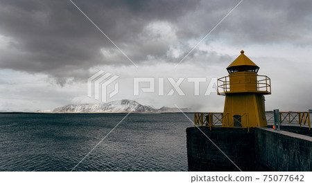 A large yellow lighthouse in Iceland, Reykjavik. A large yellow lighthouse in Iceland, Reykjavik. 75077642