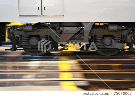 (Portrait) A dolly of a train passing through a railroad crossing (Portrait) A dolly of a train passing through a railroad crossing 75078002