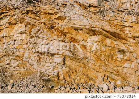 Layered stones near the road are tightened with a metal mesh netting to protect against landslides. Layered stones near the road are tightened with a metal mesh netting to protect against landslides. 75078014