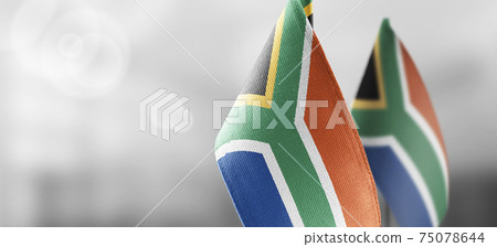 Small national flags of the South Africa on a light blurry background 75078644
