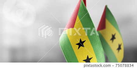 Small national flags of the Sao Tome and Principe on a light blurry background Small national flags of the Sao Tome and Principe on a light blurry background 75078834