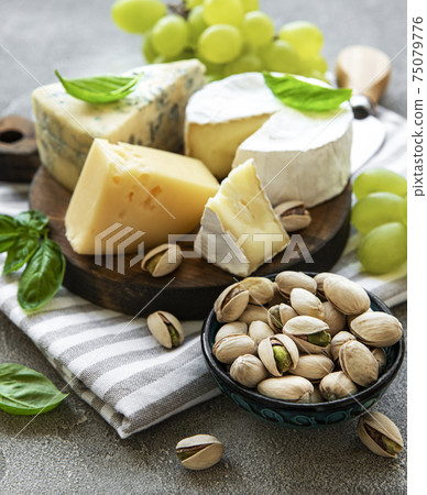 Various types of cheese and snacks 75079776
