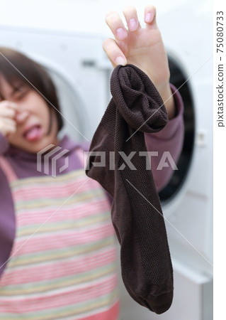 A housewife whose husband's socks smell too much when doing laundry A housewife whose husband's socks smell too much when doing laundry 75080733