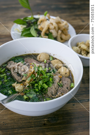 Noodles with pork and pork balls with soup Thai style 75085851