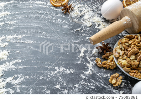 Bakery composition. Cooking food ingredients: flour, eggs, nut and star anise, orange on dark table kitchen background for cake. Top View Copy Space. Cookies Pie Or Cake Recipe Mockup. Bakery composition. Cooking food ingredients: flour, eggs, nut and star anise, orange on dark table kitchen background for cake. Top View Copy Space. Cookies Pie Or Cake Recipe Mockup. 75085861
