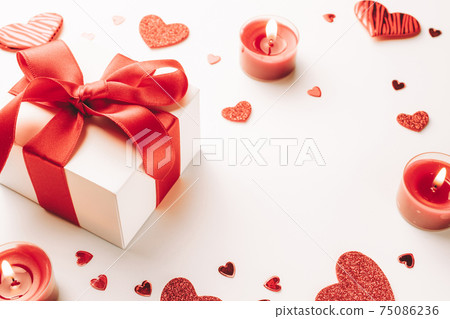 Valentines day card: red love hearts, romantic gift box, candle on white background. February romance present card. 75086236