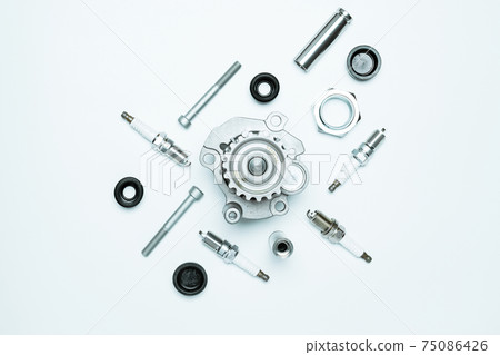Car service tools. Set of new metal car part. Auto motor mechanic spare or automotive piece isolated on white background. Technology of mechanical gear with space for text. Car service tools. Set of new metal car part. Auto motor mechanic spare or automotive piece isolated on white background. Technology of mechanical gear with space for text. 75086426
