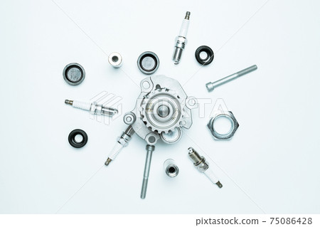Accessories for cars. Set of new metal car part. Auto motor mechanic spare or automotive piece isolated on white background. Automobile engine service with space for text. Accessories for cars. Set of new metal car part. Auto motor mechanic spare or automotive piece isolated on white background. Automobile engine service with space for text. 75086428