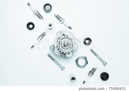 Car engine parts. Auto motor mechanic spare or automotive piece on white background. Set of new metal car part. Flat lay, top view, copy space. 75086431