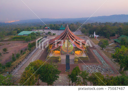 Aerial view of Wat Sirindhorn Wararam or Wat Phu Prao temple in Ubon Ratchathani, Thailand. Buddist temple. Tourist attraction landmark. Aerial view of Wat Sirindhorn Wararam or Wat Phu Prao temple in Ubon Ratchathani, Thailand. Buddist temple. Tourist attraction landmark. 75087487