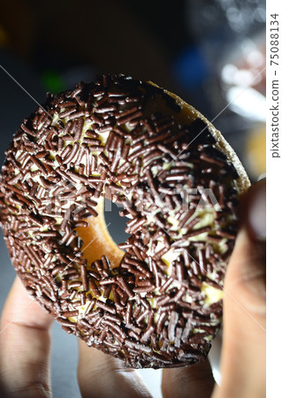 Cake, Donuts with chocolate topping sprinkled on top Cake, Donuts with chocolate topping sprinkled on top 75088134
