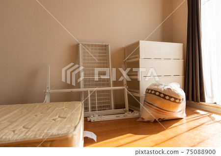A room in a studio apartment packing for moving A room in a studio apartment packing for moving 75088900