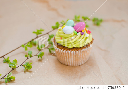 Easter pistachio cupcakes with decorations 75088941