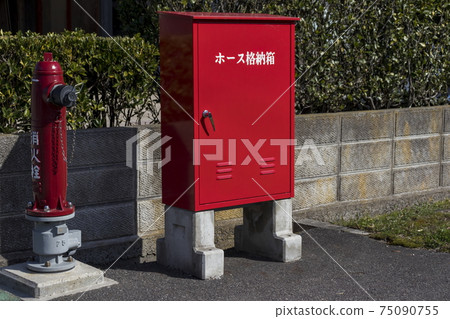 Outdoor fire hydrant on the street corner Outdoor fire hydrant on the street corner 75090755