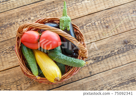 Just picked vegetables on old wooden boards. Just picked vegetables on old wooden boards. 75092341