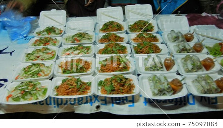 Southeast Asian sentiment: Yakisoba, fresh spring rolls and salad from Lao flour stalls Southeast Asian sentiment: Yakisoba, fresh spring rolls and salad from Lao flour stalls 75097083