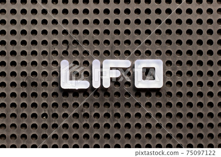White color letter in word LIFO (abbreviation of last in first out) on black pegboard background White color letter in word LIFO (abbreviation of last in first out) on black pegboard background 75097122