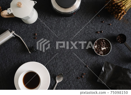 coffee cup and moka pot on black table background in kitchen room, coffee shop. 75098150