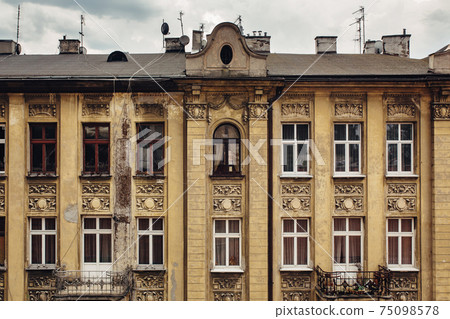 Shabby wall with rooftop of old vintage building, european architecture, residense or appartment 75098578