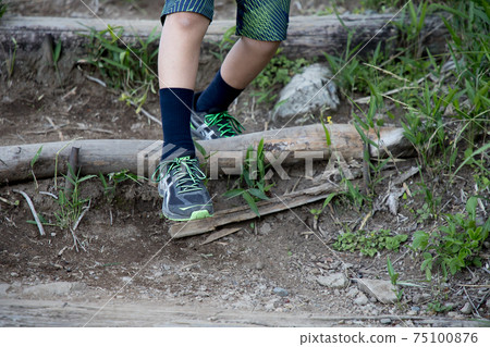 Boy's feet skipping on a hike Boy's feet skipping on a hike 75100876