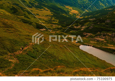 Alpine lake of the Carpathians Brebeneskul, the highest lake in Ukraine. Alpine lake of the Carpathians Brebeneskul, the highest lake in Ukraine. 75100975