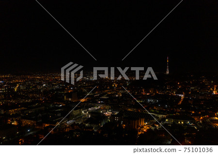 Night city of Lviv, aerial view, illuminated streets and squares of the city. 75101036