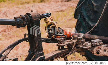 Tractor and cardan shaft for coupling equipment, tractor in the field during haymaking. 75101085